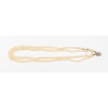 A double row graduated cultured pearl necklace with 9ct white gold clasp set with a small diamond