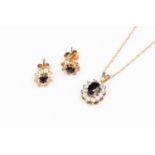 A sapphire and CZ pendant set in 9ct gold with fine chain, and two matching earrings,