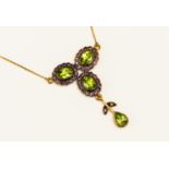 Silver gilt pendant necklace with 9ct chain set with three peridot with amethyst surrounds with a