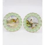 Royal Crown Derby, a pair of scene painted plates by W.E.J.