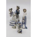 A pair of Nao Lladro figurines; a demure maid in a hat, 24 cms approx,