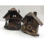 A box containing assorted cuckoo clocks,