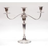 A matched George V silver three branch candelabra,