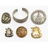 A collection of Norwegian white and gilt metal jewellery comprising brooches including two Viking