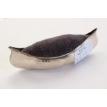An Edwardian silver mounted large pin cushion in the form of a canoe / kayak,