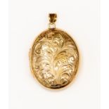 A 9ct gold oval locket, scroll and foliate engraved decoration, size approx 28 mm x 34 mm,