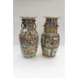 Two mid 19th Century Cantonese enamel baluster vases, twin zoomorphic handles,