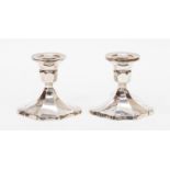 A pair of weighted silver dressing table candlesticks (2)