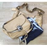 A DAVID JONES camel coloured leather saddle bag and another camel cow hyde handbag by COACH.