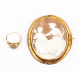 A Victorian cameo brooch, unmarked yellow metal surround along with a 19th Century mourning ring,