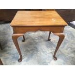 An early 20th Century mahogany side table raised on cabriole legs.