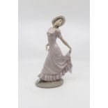 A Nao figure of a young lady with white hat, 29 cms/11.