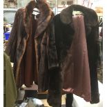 Two fur coats one being a faux fur red squirrel coat by Emma Somerset and the other is a dark brown