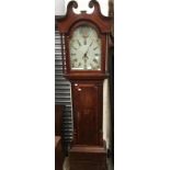 An early 19th Century oak and mahogany 30 hour longcase clock, the hood with a swan neck pediment,