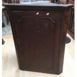 A 19th Century oak hanging corner cupboard.