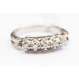 A diamond and 18ct stamped white gold ring,