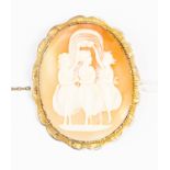 An unmarked yellow metal (tests as 9ct gold) oval cameo brooch, depicting The Three Graces,