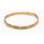 An Edwardian 15ct gold gate style bracelet, width approx 5mm, length approx 7'',