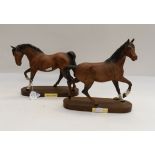 Two J Beswick horses on stands,