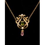 An Edwardian pendant, set with seed pearl, peridot and tourmaline, possibly 15ct,