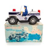 TN Toys: A boxed Japanese, Police Patrol Jeep with Stick Shift Control, battery operated.