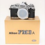Nikon: A boxed Nikon FM3a camera body, silver, complete with instructions, complete with Nikon