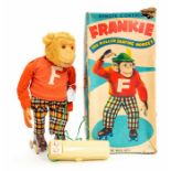 Alps: A boxed Remote Control, Frankie: The Rolling Skating Monkey, red jumper, check trousers, brown