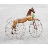 Horse: A child's French 19th Century mechanical tricycle in the form of a prancing horse, possibly