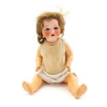 Koppelsdorf: An early 20th Century bisque head doll, marked '320.0 Germany', open and close eyes,