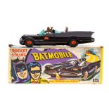 Corgi: A boxed Corgi Toys 'Rocket Firing Batmobile' complete with Batman and Robin figures, original