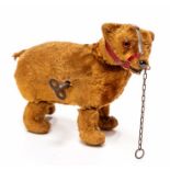 Schuco: An early 20th Century Schuco mohair clockwork bear with muzzle, 16cm approx.
