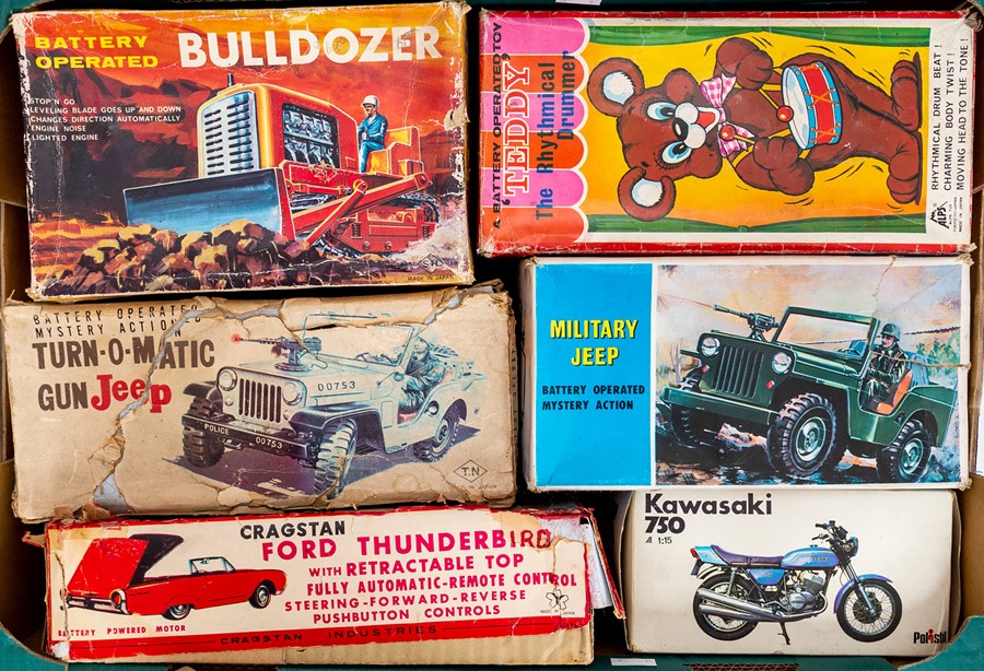 Tinplate: A collection of boxed tinplate and plastic vehicles to include: Bulldozer, Gun Jeep,