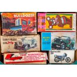Tinplate: A collection of boxed tinplate and plastic vehicles to include: Bulldozer, Gun Jeep,