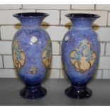 A pair of Royal Doulton baluster stoneware vases, relief decorated floral decoration to mottled blue