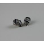 A pair of white metal, sapphire and diamond oval earrings, set twin horizontal rows of five square