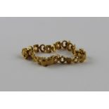 A 22ct. gold fancy link bracelet, each shaped link of mixed brushed and faceted polished finish,