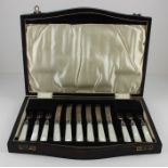 A cased silver and simulated mother of pearl knife and fork set for six, by Cooper Brothers & Sons