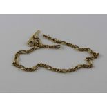 An 18ct. gold Albert chain, formed from alternating single long and series of four short curb links,