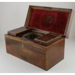 A mahogany tea caddy, of rectangular form, the interior fitted with twin tea cannisters and