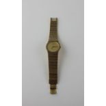 A gold plated Raymond Weil bracelet watch, ref.9042, quartz movement, having signed gold dial with