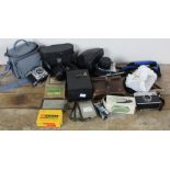 A collection of vintage cameras and related items