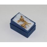 An Italian 18ct. yellow gold "Bambi" brooch, having textured finish to simulate fur, set three round