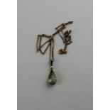 A 14ct. yellow gold, aquamarine and seed pearl pendant, claw set pendeloque cut aquamarine with
