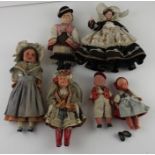 An Armand Marseille pre-war German bisque headed doll, dressed in national costume, with closing