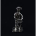 A silver miniature figurine of military drummer, by "EE & TH", assayed London 1979, dressed in the