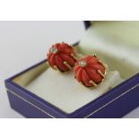 A pair of 18ct. gold and pink coral and diamond earrings, each fashioned as a stylised crown with