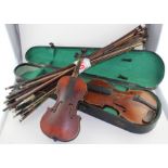 A collection of antique violin bows, a tiny violin and a cased violin labelled Bienfait