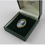 An 18ct. yellow gold oval cameo brooch, the cameo of black jasper ware style and of a profile bust