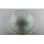 An opalescent glass bowl, in the style of Lalique, moulded to exterior with a starfish upon wavy