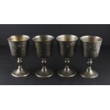 A set of four silver goblets, by Wakely & Wheeler, assayed London 1966, having bucket bowls, stem